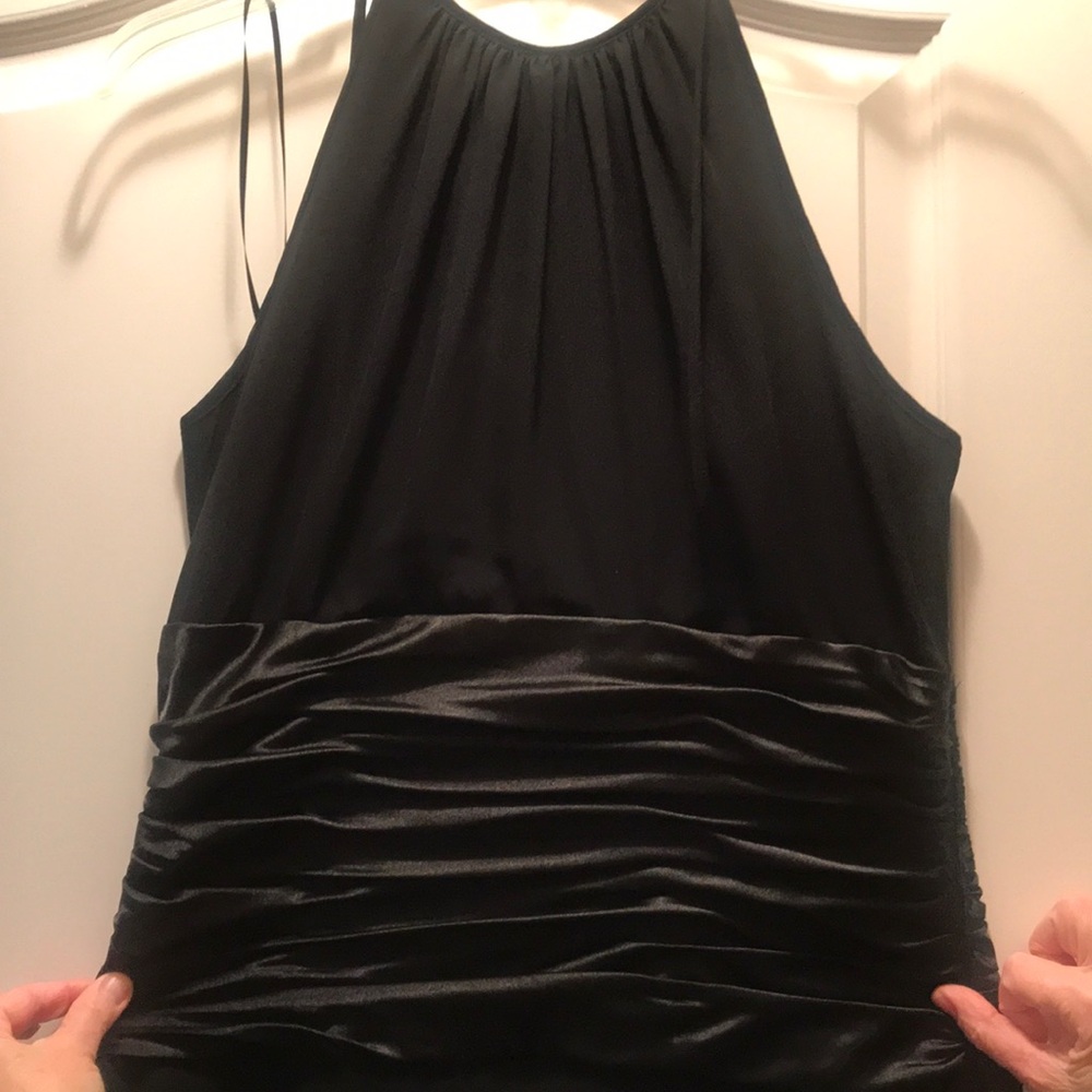 Beautiful formal black dress with side zipper. Below the knee.